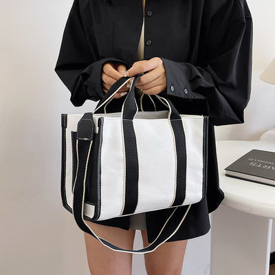 Hauptmaterial PU GHJ-31 Handtaschen für Frauen mit Bewegungserkennung und gestreiftem Design