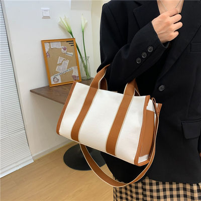 Hauptmaterial PU GHJ-31 Handtaschen für Frauen mit Bewegungserkennung und gestreiftem Design